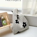 Detail of floral knit tote bag resting on window sill with natural soft lighting - Abstract Black Flower / Off White