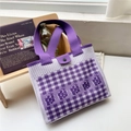 Detailed view of purple checkered knit tote bag with floral patterns and snap closure - Purple Checkerboard Flower