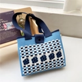 Detail of blue checkerboard knit tote bag featuring heart patterns and wide strap - Blue Checkerboard Flower