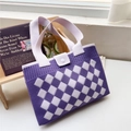 Detail of purple and white checkered knit tote bag with button closure and wide strap - Rhombus Grid Purple