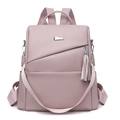 Versatile anti-theft mauve faux leather backpack with fringe and woven shoulder strap - Pink