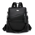 Large black anti-theft backpack in lychee grain faux leather with tassel detail - Black