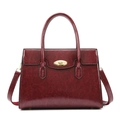 Detailed macro view of the dark red textured leather tote with golden oval turn lock - Wine Red Single Bag
