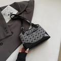 Chic black and white checkered shoulder bag with heart pendant on a minimalist background - Black without Pendant