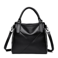 Minimalist black pebble leather tote bag with V-shaped stitching and silver hardware - Black