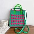 Detail of green and pink checkered knit tote bag with round handle and woven shoulder strap - Green & Rose Red Argyle