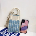 Detail of blue chevron knit pattern mini bag with round handle and phone for scale - Beige & Blue Wheat Ear