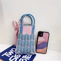 Detail of pink and blue knit mini phone bag with V-shaped geometric pattern and strap - Pink & Blue Wheat Ear