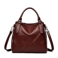 Elegant wine red leather handbag with geometric stitching and silver side zippers - Burgundy