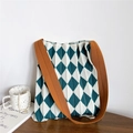 Detail of green argyle knitted tote bag with pleated texture and wide orange strap - Green and White Argyle (Orange Strap)
