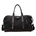 Borsa da viaggio in tela nera con base in pelle marrone e tracolla regolabile - Nero
