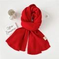 Vibrant red ribbed knit scarf for women with thick texture and fabric care label - Red