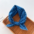 Navy blue polka dot cotton linen neck scarf displayed on a woven tray - Polka Dot Blue (3)
