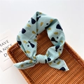 Close-up of a mint green cotton-linen scarf with elegant dress and rose patterns - Princess Flower Green (8)