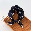 Detail of floral printed black cotton linen scarf with white edge stitching on rattan tray - Princess Flower Navy (9)