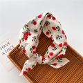 Detailed view of lightweight red floral cotton linen scarf on a brown woven tray - Red Sophora Beige (15)
