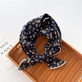 Detail of navy blue cotton-linen scarf featuring autumn leaf prints and fine white stitching - Colorful Leaves Navy (30)
