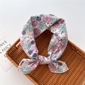 Detail of cotton linen scarf with floral cat print on a rustic woven tray - Cat Floral Beige Pink (32)