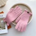 Detail of pink knitted gloves with thick ribbed texture and leather logo patch - Pink (Ruffle Cuff)