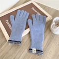 Close-up of light blue ribbed knit touchscreen gloves with HII ORIGINAL label on wood - Blue
