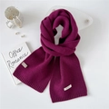 Thick deep purple 100% wool knitted scarf for women in a minimalist flat lay lifestyle view - Purple