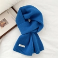 Klein blue 100% wool knitted scarf with ribbed edges on a white background - Sapphire Blue