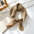 Elegant brown and white houndstooth cotton linen square scarf tied in a stylish knot - Khaki Houndstooth Stripe