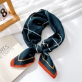 Deep teal cotton linen square scarf with white stripes and orange hem tied in a bow - Navy Minimalist Grid