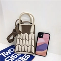Close-up of contrast color knitted mini tote with geometric patterns and round handles - Coffee & Beige
