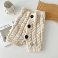 Knitted button cowl scarf in cream white with cable stitch texture and elegant black buttons - Beige