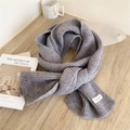 Light gray knitted ribbed scarf with Trendy Scarf label in a cozy winter setting - 21x162cm / Gray