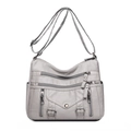 Gray multi-pocket crossbody bag with pebble grain texture and adjustable shoulder strap - White