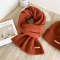 Caramel knit wool scarf and beanie set with ribbed texture and metal brand tag - Orange Red