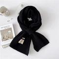 Chic black ribbed knit scarf featuring minimalist brand label for winter warmth - One Size / Black