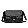 Black vintage motorcycle baguette bag with silver twist locks and washed leather texture - Black