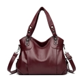 Deep burgundy lychee textured leather handbag with dual handles and adjustable strap - Fuschia