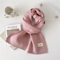 Soft light pink knitted scarf for women featuring a minimalist emo label and cozy texture - Pink