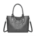 Grey faux leather tote bag with lychee texture and adjustable shoulder strap on white base - Dark Gray