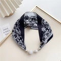Macro shot of black and white lace floral silk scarf with magnetic rhinestone balls - Black and White Lace Floral