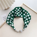Macro detail of dark green polka dot silk scarf with sparkling rhinestone magnetic clasps - Dark Green Hearts and Dots