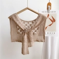 Detalle del chal de encaje de ganchillo beige con motivos florales y lazos frontales - 35*76cm / Camel