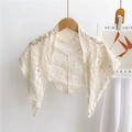 Knitted hollow lace shawl in cream white featuring vintage crochet patterns and small pom-pom trim - Cream
