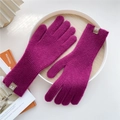 Detail of purple knitted gloves with vertical texture and leather logo on white tray - One Size / Purple