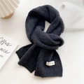 Detail of gray knitted scarf with handmade fashion label on a minimalist home background - 22x180cm / Dark Grey