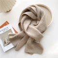 Close-up of oatmeal knit scarf showing ribbed texture and minimalist GRACE woven label - Beige Coffee