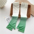 Detail of green gradient cooling arm sleeves with fingerless design and elastic cuffs - One Size / Gradient Deep Green