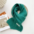 Dark green chunky knit scarf with vintage cable pattern and decorative woven label - Green