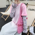 Close-up of pink ice silk sun sleeves with floral patterns and ruffled edges detail - One Size / Ink Floral