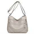 Light gray faux leather crossbody bag with multiple zip pockets and rivet details - Light Gray