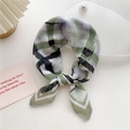 Stylish green and black checkered cotton linen scarf tied in a bow on a clean white desk - Brush Stroke Stripe Green (22D) / 58cm